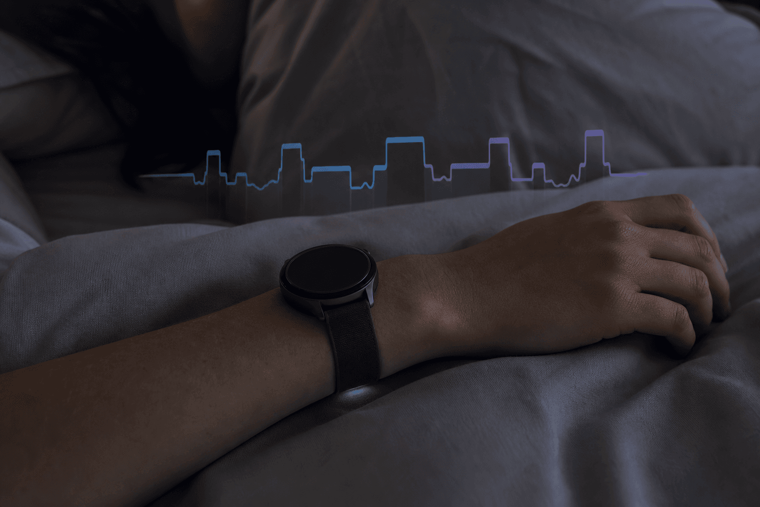 A wrist wearing a smartwatch resting on pale grey bedding in dim light, with a translucent sleep stage waveform overlaid in muted blues and purples.