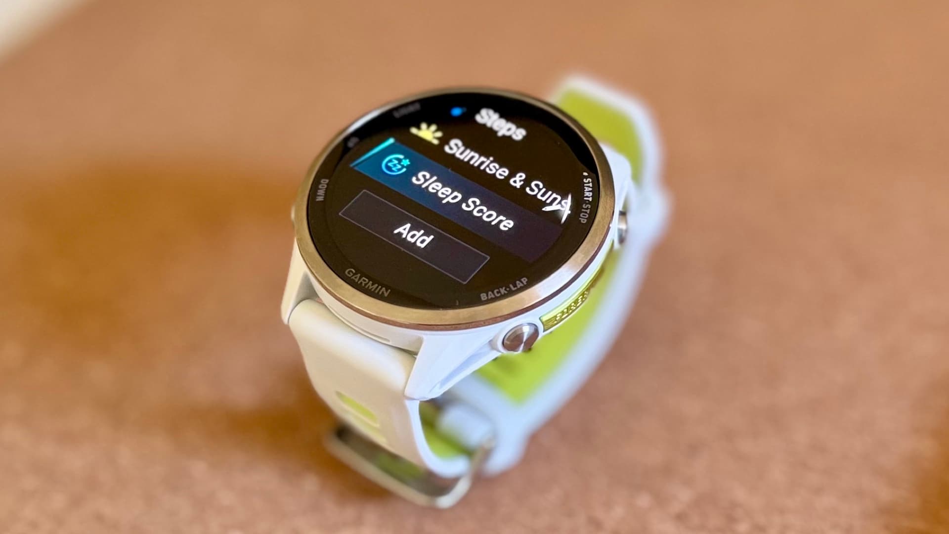 Garmin watch displaying a Sleep Score widget with sleep duration and sleep stage summary