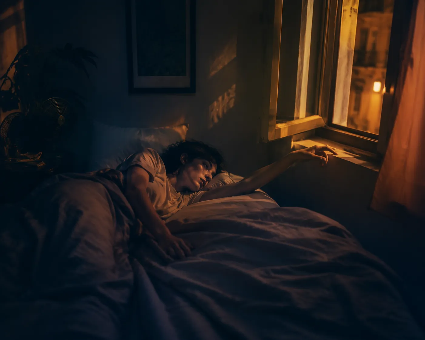 Restless person lying awake in a warm nighttime bedroom